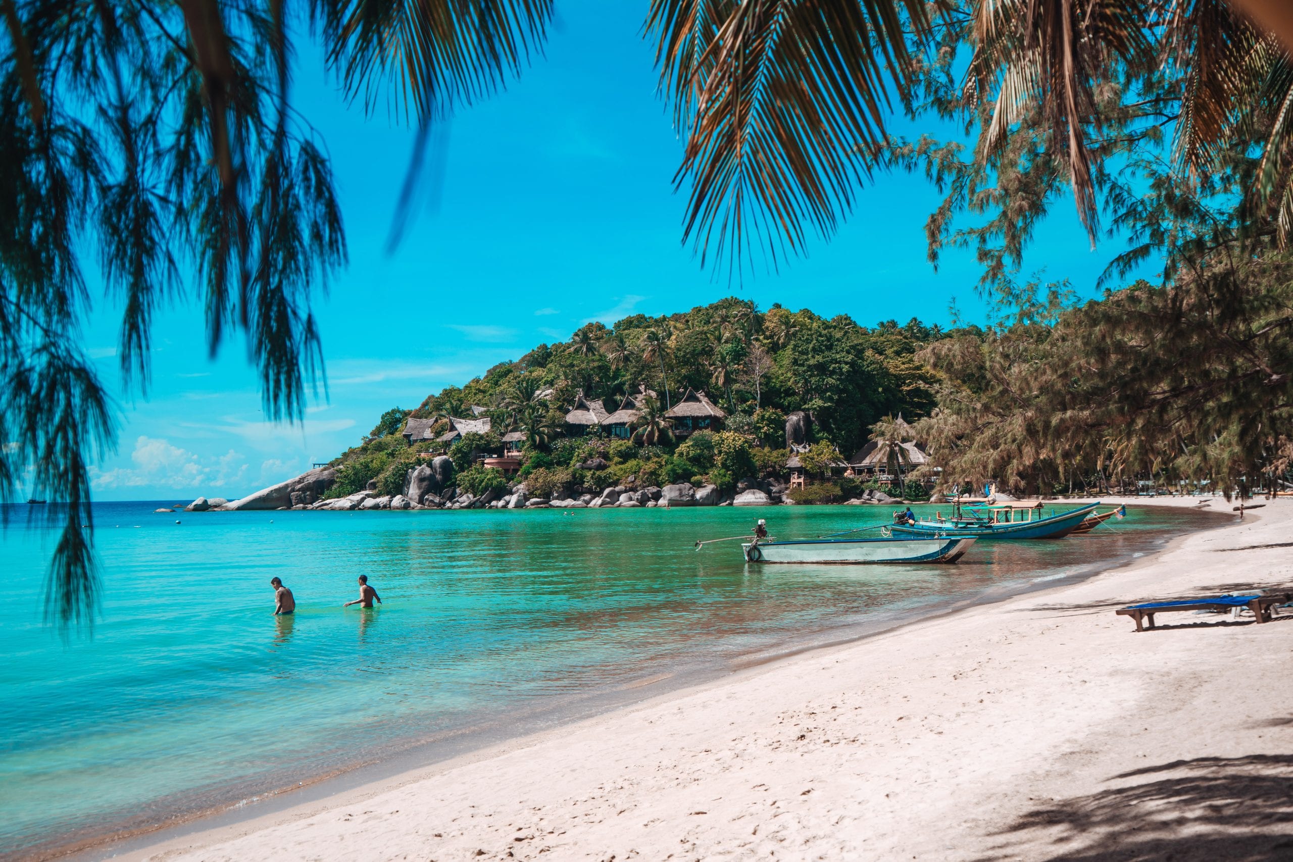 Still water off a quiet Koh Tao beach, the pace a retreat is built around