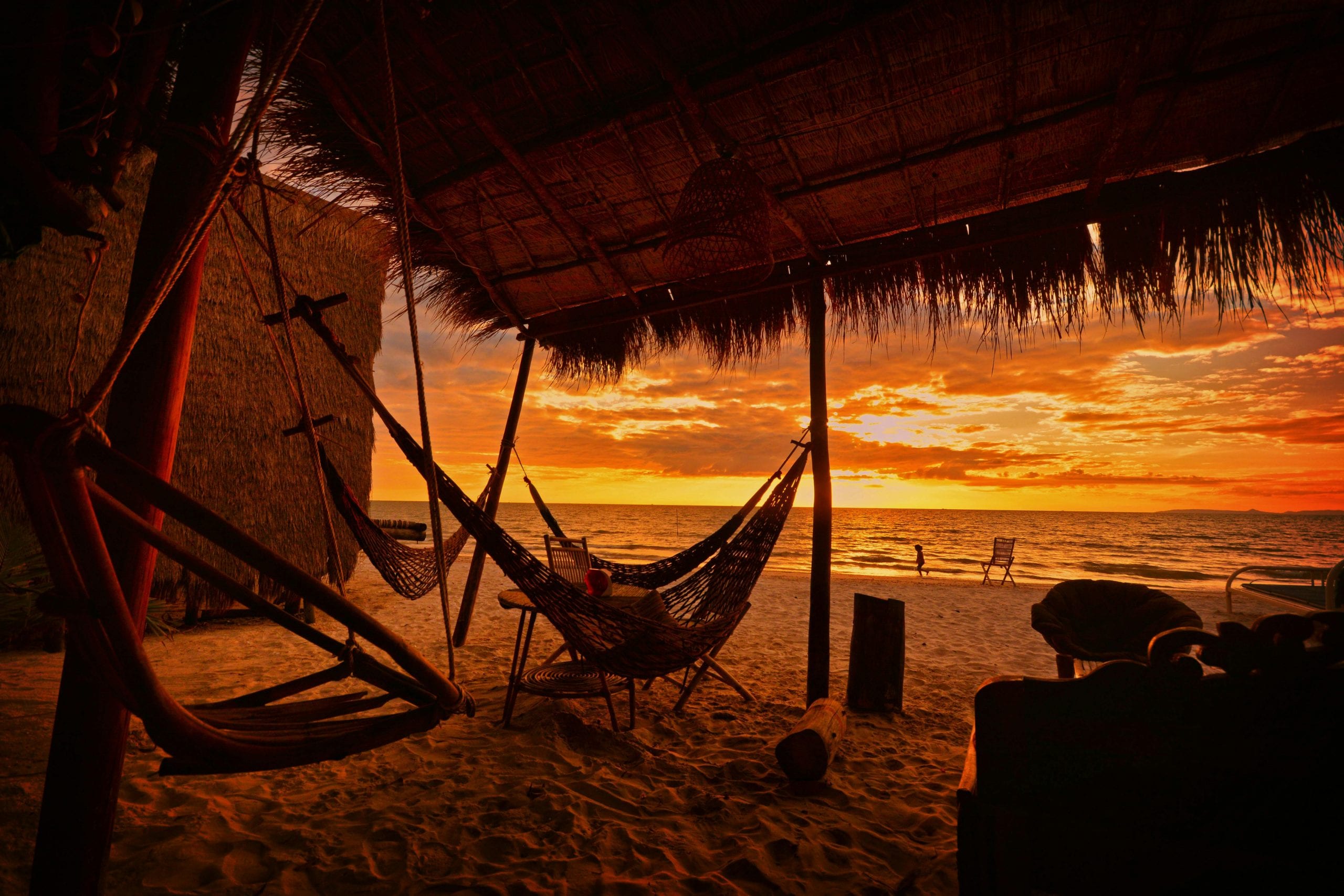 A hammock strung under a thatched roof, Koh Tao mornings at their slowest